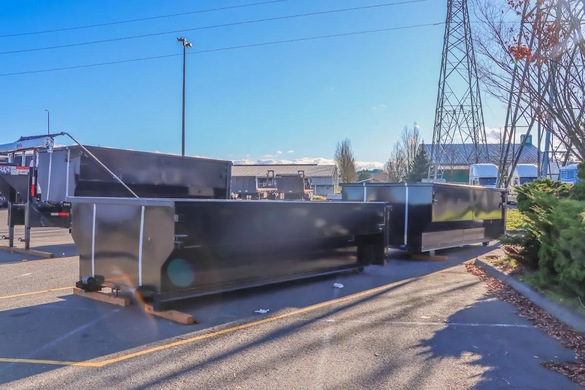 Roll-off dumpster ready for waste disposal at job site for 2 Yard Dumpster Rental in Winston